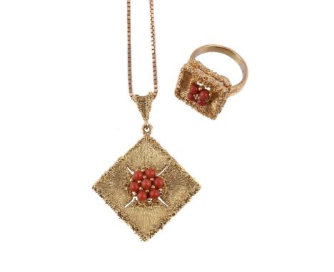 ϒA 1970s coral dress ring, the textured square panel centrally set with four coral beads, on a textured shank, finger size R,