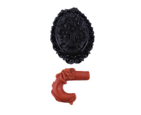 A Victorian jet brooch, the central oval panel carved with foliage, within a carved surround with bead and detail, 6.4cm long