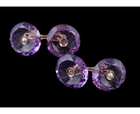 A pair of early 20th century amethyst and half pearl double sided cufflinks, the circular facetted amethyst panels each centr