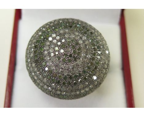 White metal Ring pave set with small diamonds in a large cluster form size N weight 15.0 grams