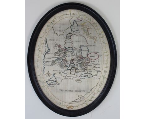 Early 19th century Map Sampler depicting the British Isles in a period oval frame and embroidered with a foliate border