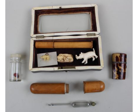 A jar of miniature carved ivory animals, other carved animals, a tortoiseshell jewel casket and similar perfume bottle and tw