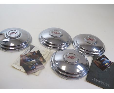 A set of hubcaps from a rare vintage Jensen C-V8 along with ephemera and pictures