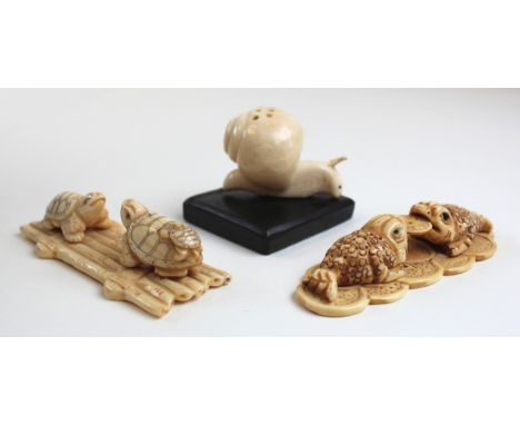 Three Japanese carvings of a snail as a netsuke, tortoises and carp all early 20th century 