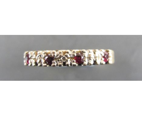 18ct gold ring with a band of small rubies and diamonds, ring size Q. approx 2.4g
