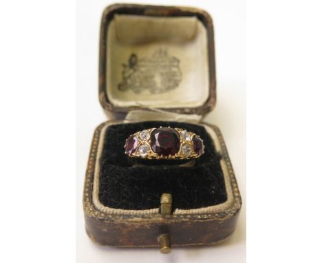 18ct Garnet and Diamond Ring size J weight 3 grams