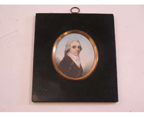 Extremely fine Miniature portrait in oils on ivory of a regency gentleman in a brass mounted ebonised frame