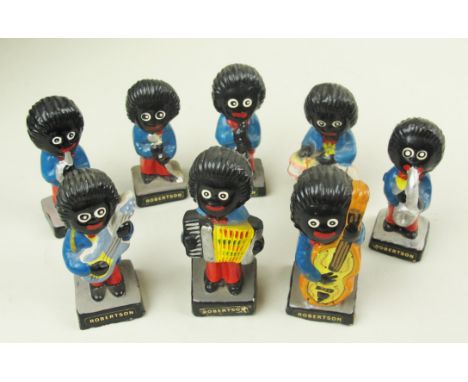 Eight ceramic vintage Robertsons "Golly" figures painted and representing a band.