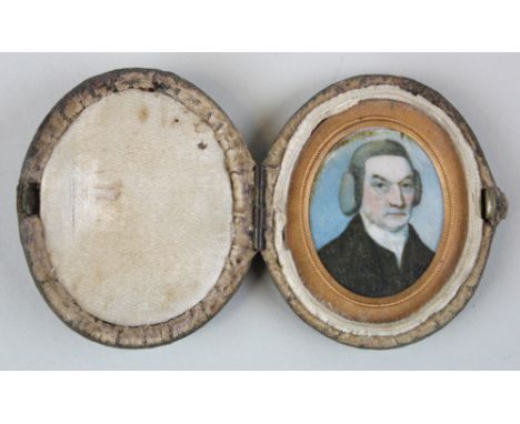Regency period miniature portrait of a gentleman set within a pinchbeck frame and housed in a hinged fabric casing