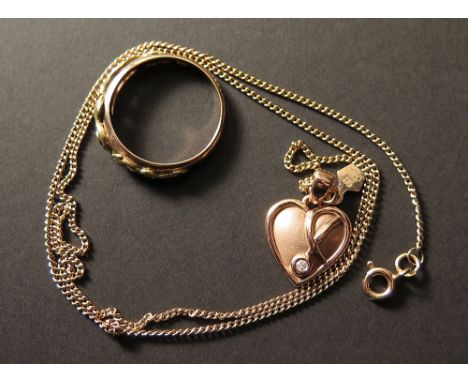 A Clogau 9ct gold ring along with a gold necklace with a heart attached. Comes with a certificate of authenticity, total weig