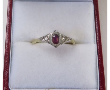 18 carat gold and platinum ring, the diamond shaped platinum head set with central ruby, with two diamonds either side, ring 