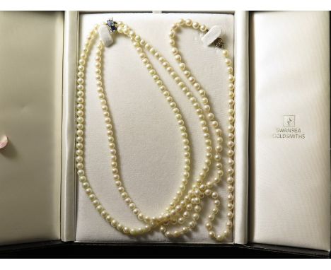 A two row pearl necklace on an 18ct gold sapphire and diamond clasp along with a single row pearl necklace on a hallmarked go