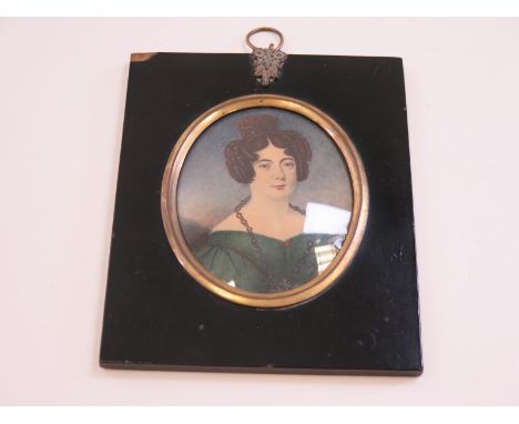 Well executed and fine quality regency period portrait miniature of a young lady circa 1835 mounted within a square ebony fra