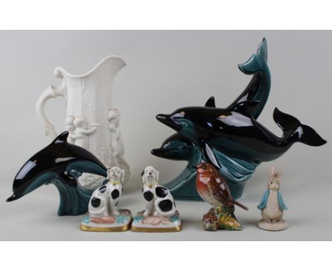 Mixed lot of a minton jug, two lots of poole dolphins, a beswick bird, two dalmation models and a peter rabbit