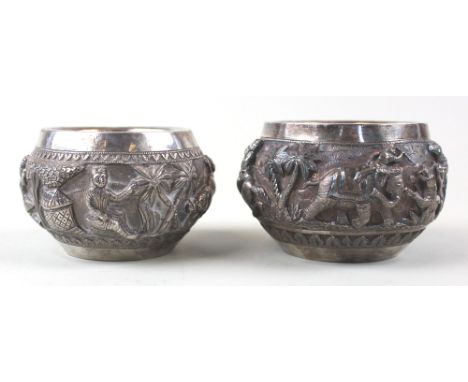 Pair of very fine early 20th century Indian white metal embossed pots. Decorated with hunting scenes.
