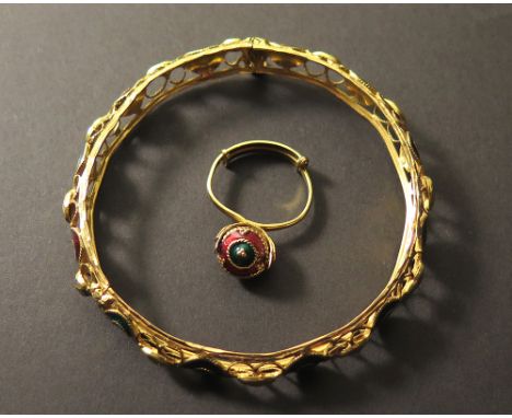 Yellow metal bangle & matching ring, with the bangle stamped 21k. the ornate bangle having green & red enamelled circles. tot