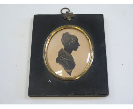 Mid Victorian Silhouette miniature portrait of a lady with her hair up, heightened with gilt highlights