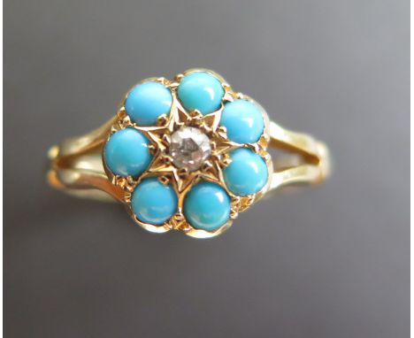 18ct Ring, central Diamond surrounded by Turquoise stones size L weight 2.7 grams 