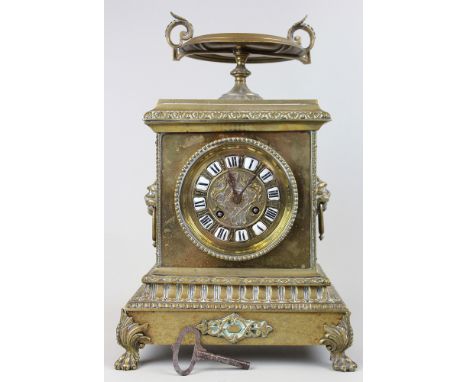 19th Century Neo Classical style brass mantle clock striking on a bell and standing 14"