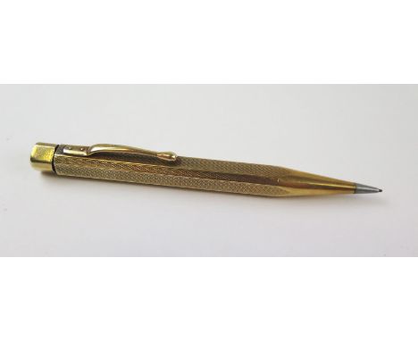 14 carat gold pencil, stamped 585, engine turned, 11.5cm long