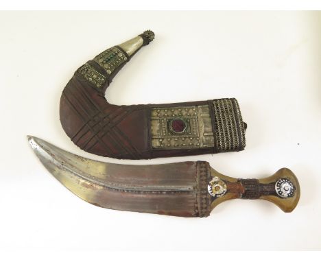 Arabian styled old Jambiya dagger, wooden handle, leather scabbard and silver decoration, with silver coins ? to handle