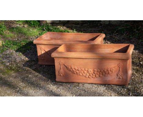 Each planter with flowerhead and fruiting swag ornament.83cm wide x 41cm deep x 35cm highQty: 2In generally good condition. M