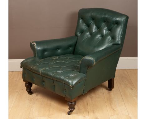 With a green leather button back and seat, on turned front legs and castors.93cm wide x 90cm highQty: 1The castors are somewh