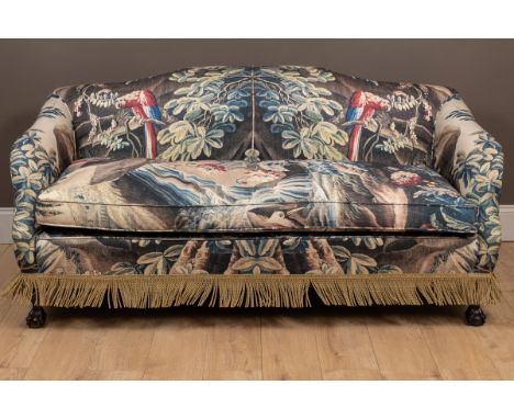 With a camel back, the single cushion seat above a tassel apron over claw and ball feet.178cm wide x 78cm deep x 87cm highQty