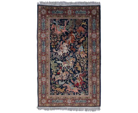 The blue ground with a hunting scene and guarded border with Arabic script in shaped cartouches.228cm x 138cmQty: 1Some light