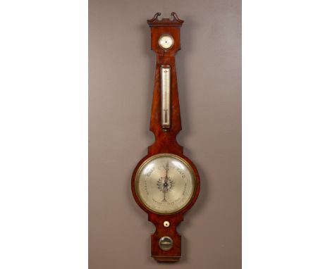 The scrolling broken arch pediment above a hydrometer thermometer and with level beneath the main dial signed 'Woodruff of Ma