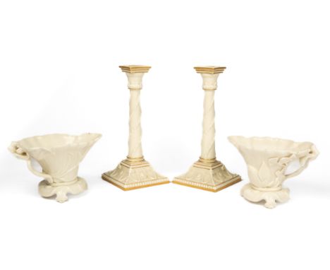 The pair of porcelain libation cups in the Oriental manner and with impressed marks. The ivory ground porcelain candlesticks 