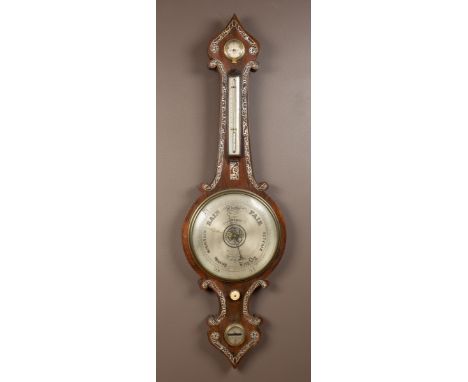 The barometer with an onion shaped top, silvered dials to the hydrometer, thermometer, barometer, and level. The case with de