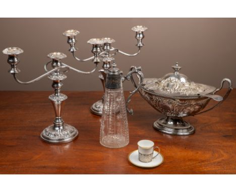 The lot comprising of a Mappin &amp; Webb Princes plate; a lidded claret jug with a classically styled silver collar and hand