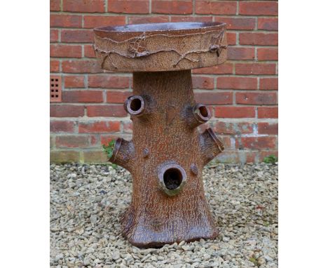 The planter with a shallow bowl to the top and naturalistically moulded (trunk) support. The bowl decorated with trailing ivy