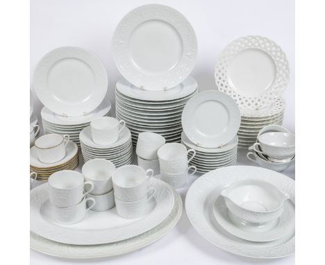 The dinner service with a white ground and moulded classical decoration to the border.The lot consisting of seventeen dinner 