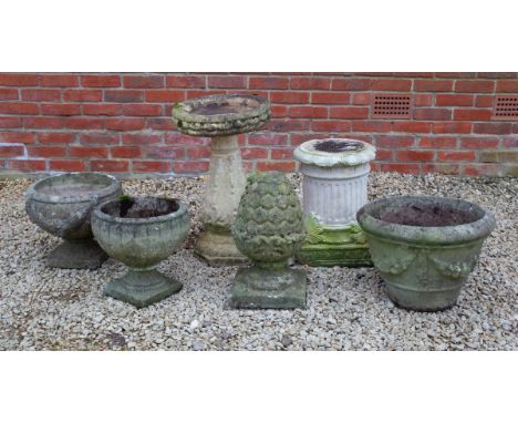 Consisting of three cast reconstituted stone planters; a fluted pedestal; a bird bath; and a pinecone finial.The bird bath 43