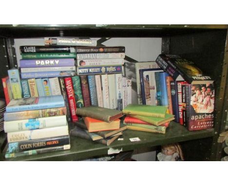A shelf of books including biography