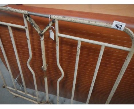 A vintage metal stair gate