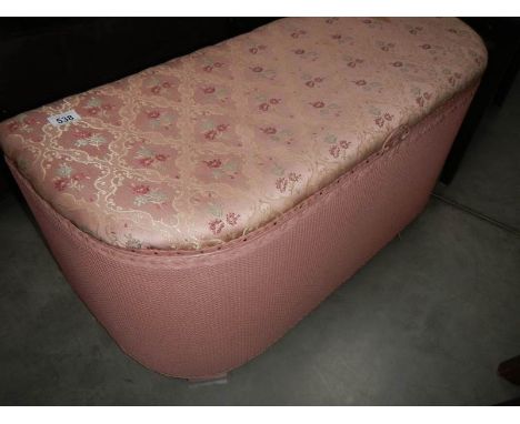 An ottoman containing vintage hats