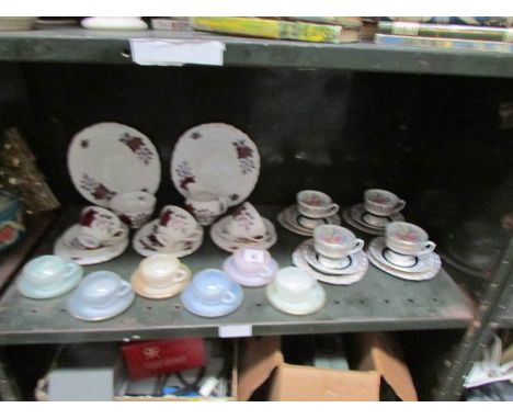 A shelf of assorted tea ware