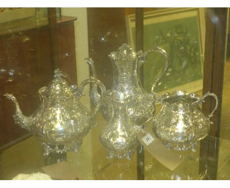 SOLD IN TIMED AUCTION
A silver plated item four piece teaset with profuse foliate decoration 