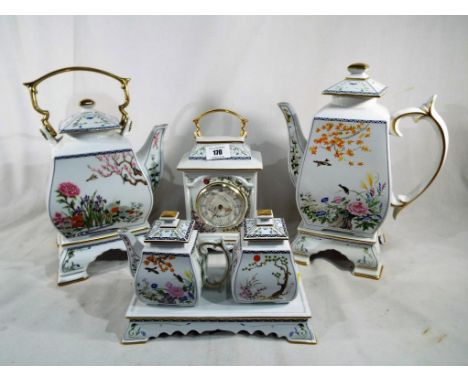 A collection of good quality ceramic ornamental ware by Franklin Mint decorated in a floral pattern (qty)