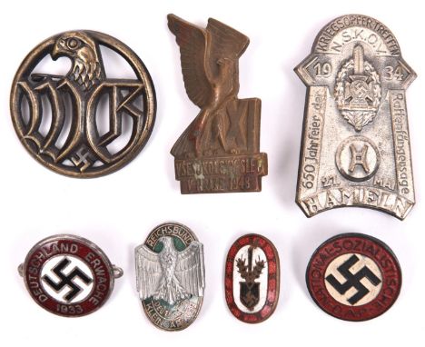 2 Third Reich pin-back enamel badges. “Deutschland Erwacht 1933” and “Arbeits Dank”; a painted NSDAP party badge; an N.S.K.O.