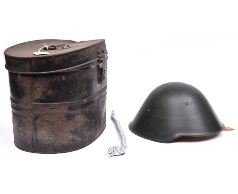 An E German Volksarmee steel helmet, dark green with pale brown leather padded liner and chinstrap; a Frontier Guards plaited