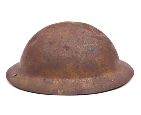 A WWI raw edge Brodie's pattern steel helmet, red painted black letter “Z” (Channel Islands ?), leather chinstrap, white clot