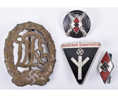 Grouping of Third Reich Badges, consisting of bronze grade DRL sports badge with pin fitting to the reverse; Frauenschaft ena