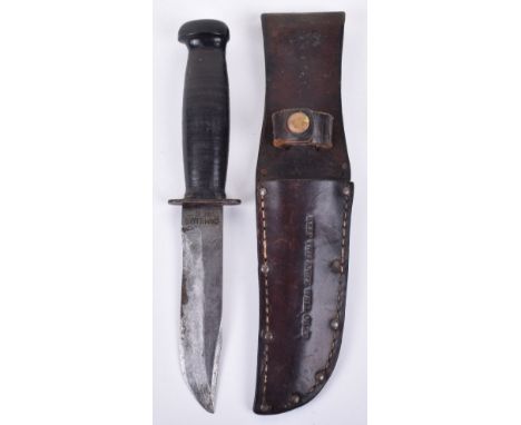 American US Navy MK1 Fighting Knife, housed in studded leather scabbard which is marked “KEEP THIS KNIFE WELL OILED”. Single 