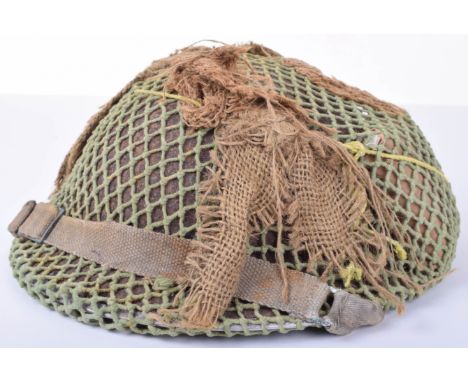WW2 British Steel Combat Helmet with Camouflaged Net, fine example of a standard WW2 British steel combat helmet complete wit