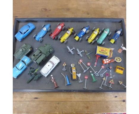 Seven vintage Dinky racing cars and nine other diecast vehicles/planes and assorted road signed and pumps etc 