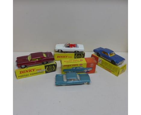 Four boxed Dinky toys American cars - Plymouth Fury Sports 115, Pontiac Parisienne 173, Ford Mercury Cougar 174 and Cadillac 